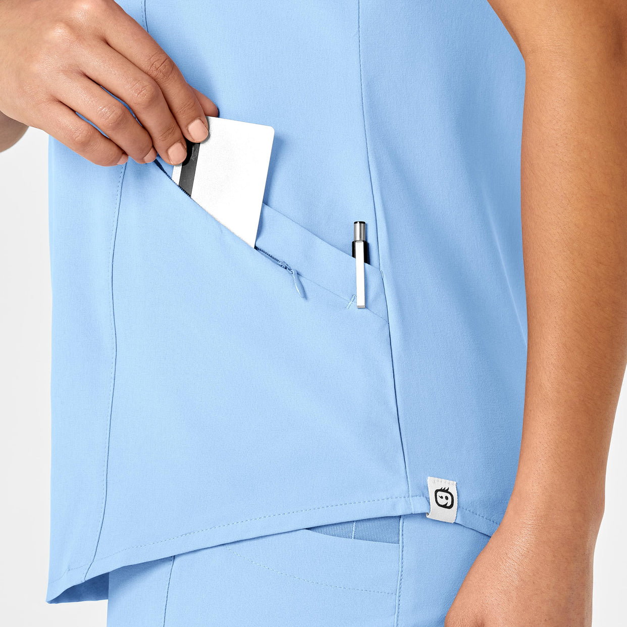 RENEW Women's V-Neck Scrub Top - Powder Blue pocket detail