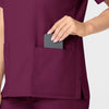 WonderWORK Women's V-Neck Scrub Top Wine hemline detail