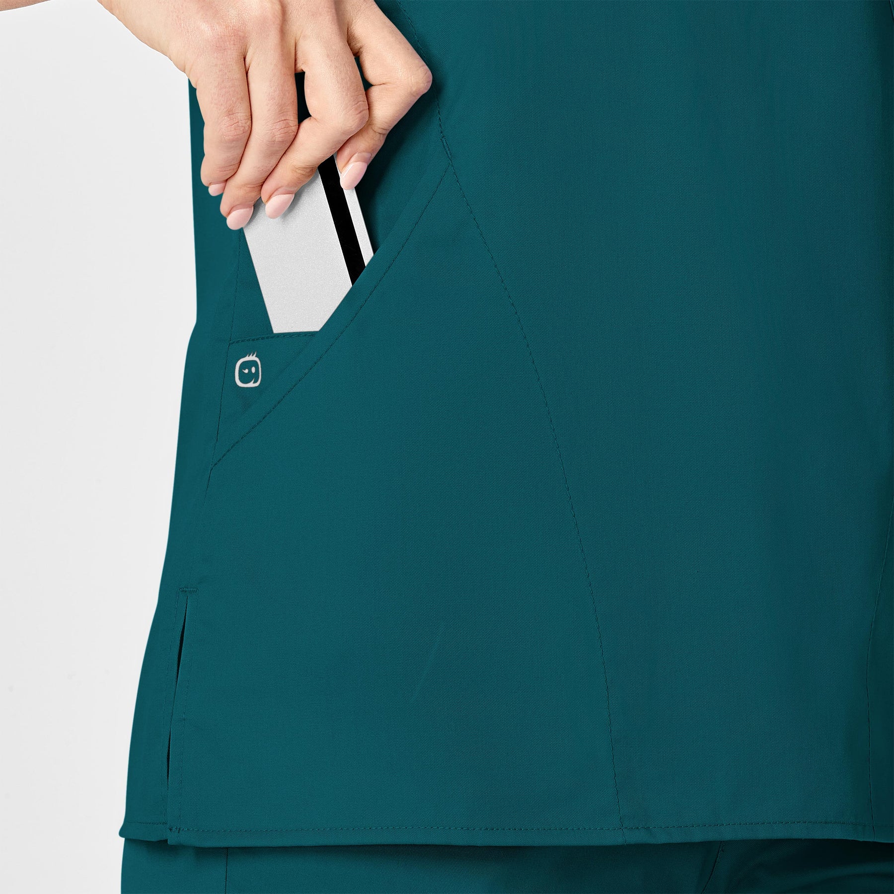 WonderWORK Women's Mock Wrap Scrub Top Caribbean Blue hemline detail