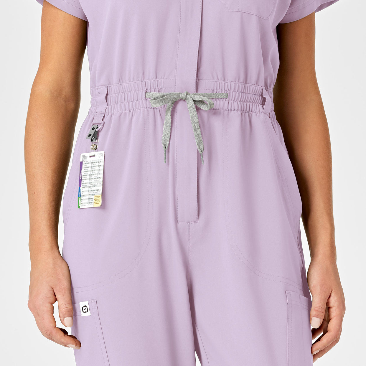 RENEW Women's Zip Front Scrub Jumpsuit Pastel Lilac waistband detail and badge loop