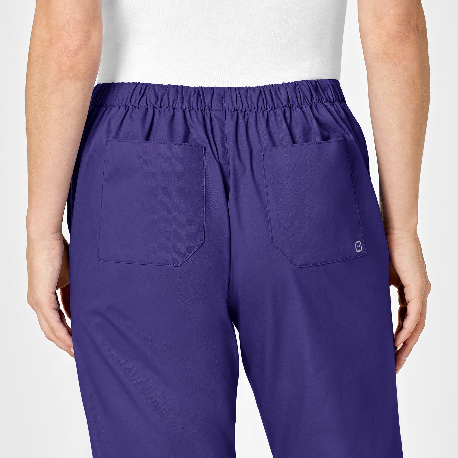 WonderWORK Women's Flare Leg Scrub Pant Grape hemline detail