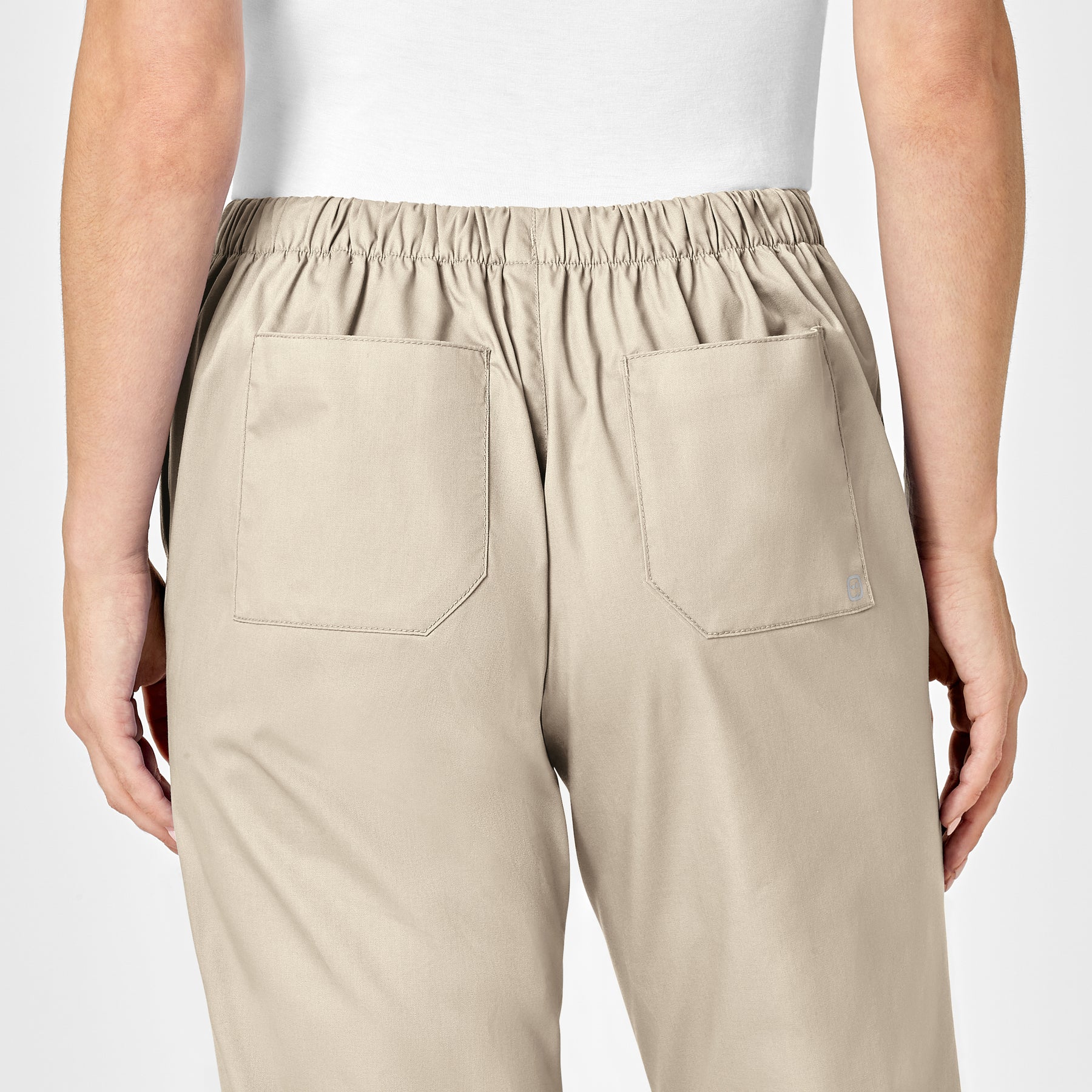 WonderWORK Women's Flare Leg Scrub Pant Khaki hemline detail