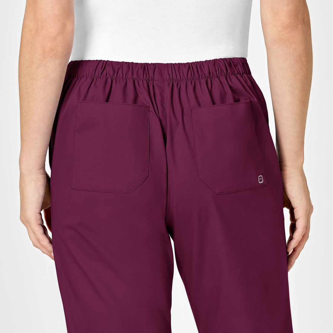 WonderWORK Women's Flare Leg Scrub Pant Wine hemline detail