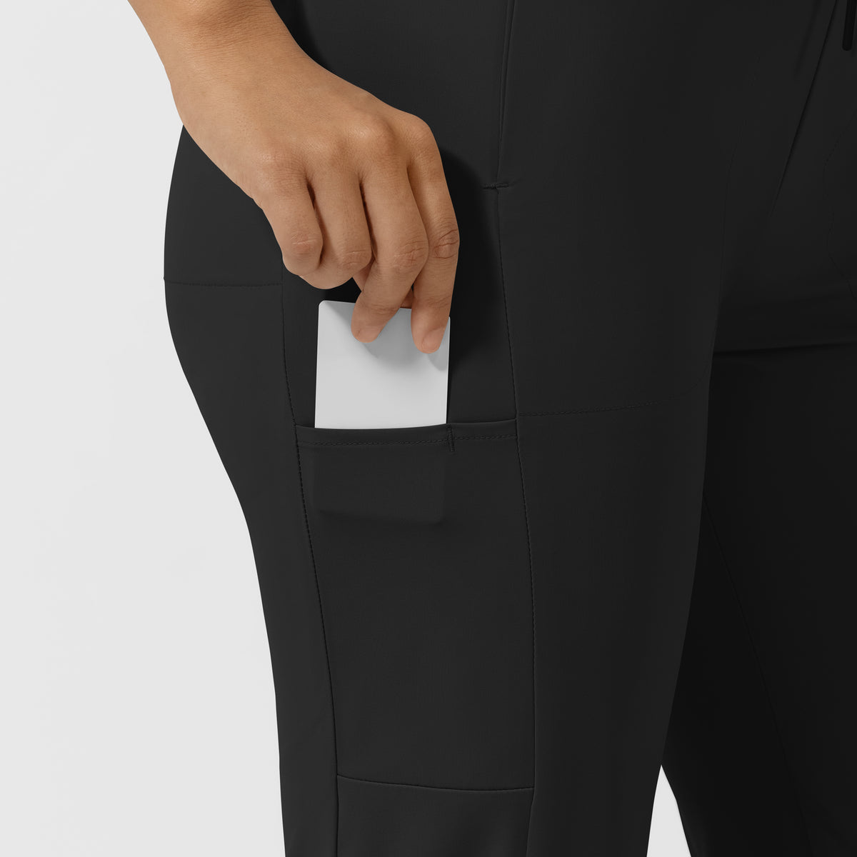 AURA Women's Glide Tapered Scrub Pant - Black pocket with pen slot