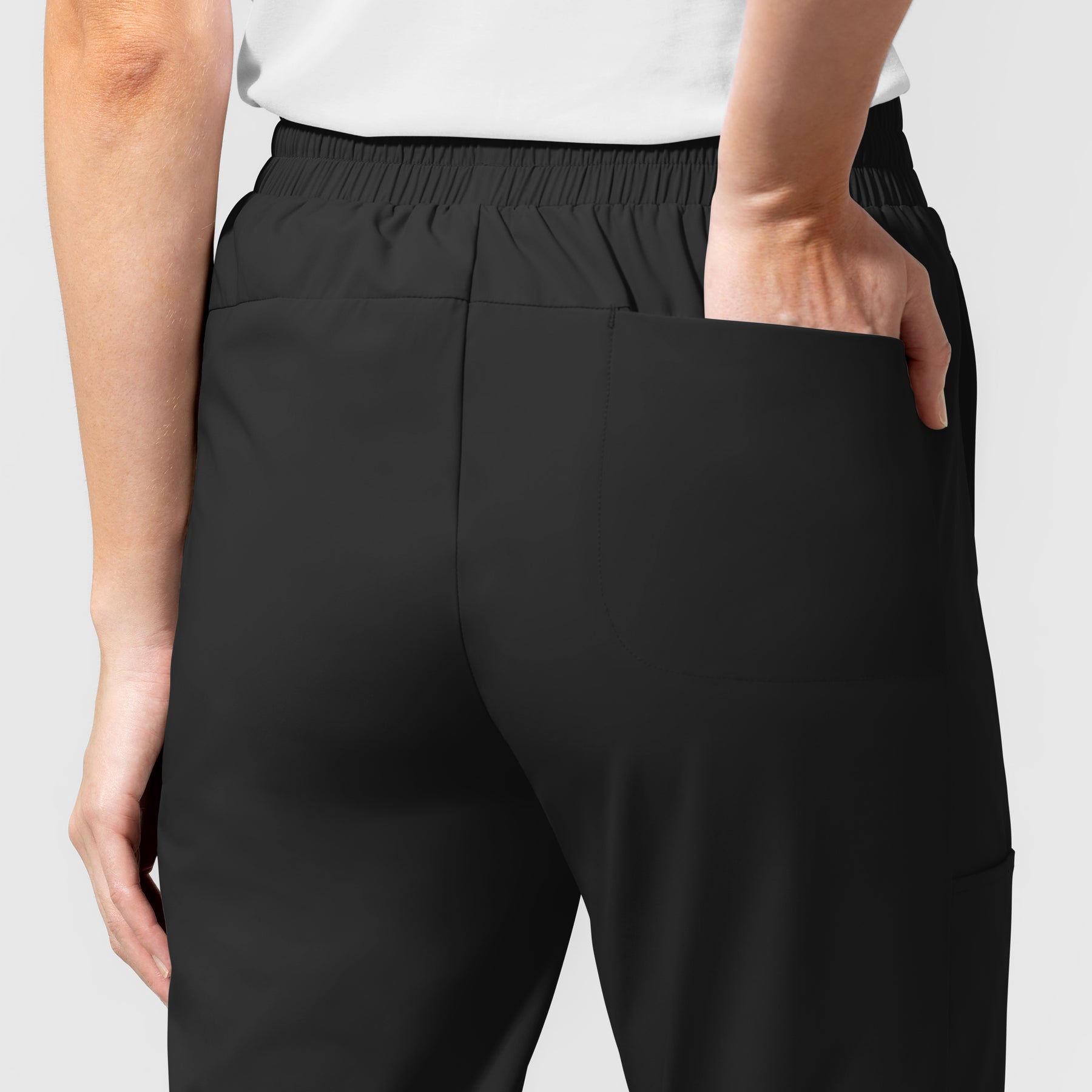 AURA Women's Glide Mid Rise Tapered Scrub Pant Black hemline detail