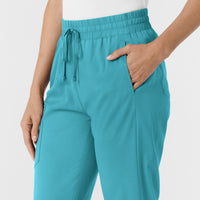 Boundless Women's Bootcut Scrub Pant Teal hemline detail