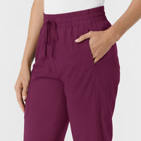 Boundless Women's Bootcut Scrub Pant Wine hemline detail