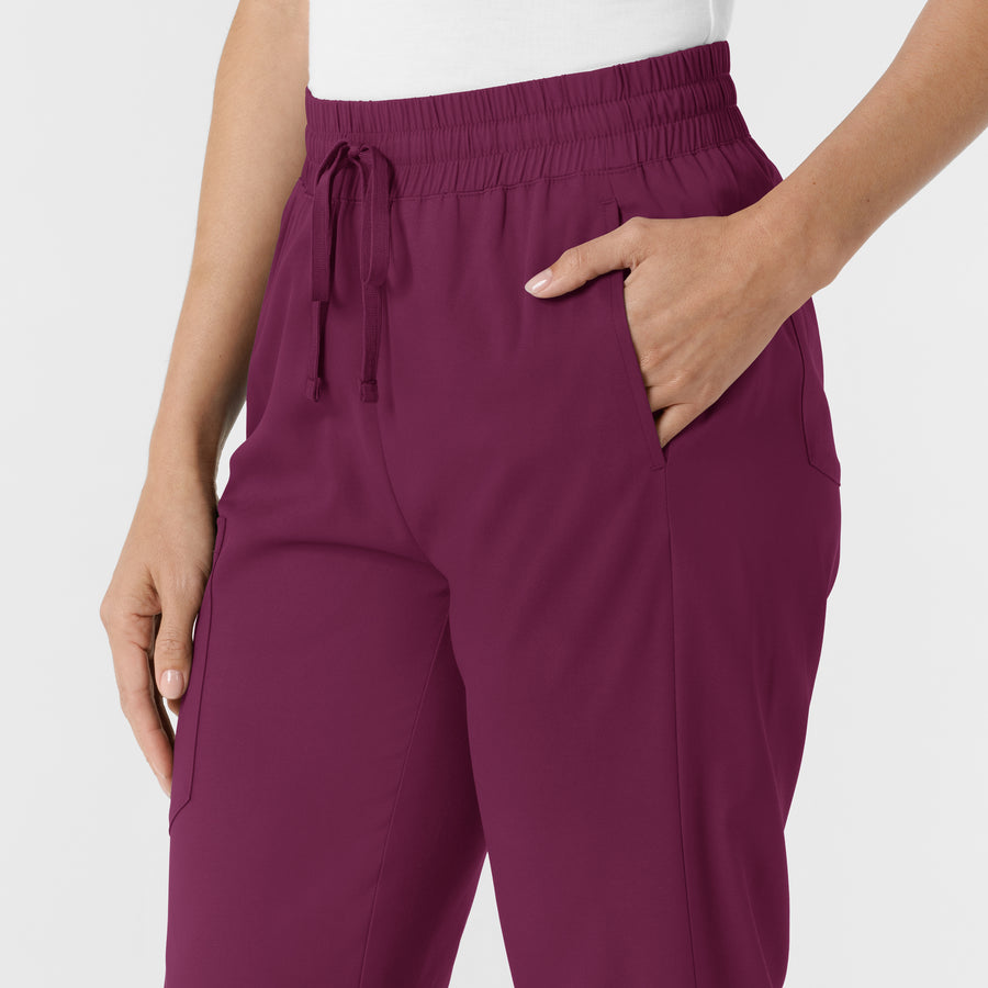 Boundless Women's Bootcut Scrub Pant Wine hemline detail