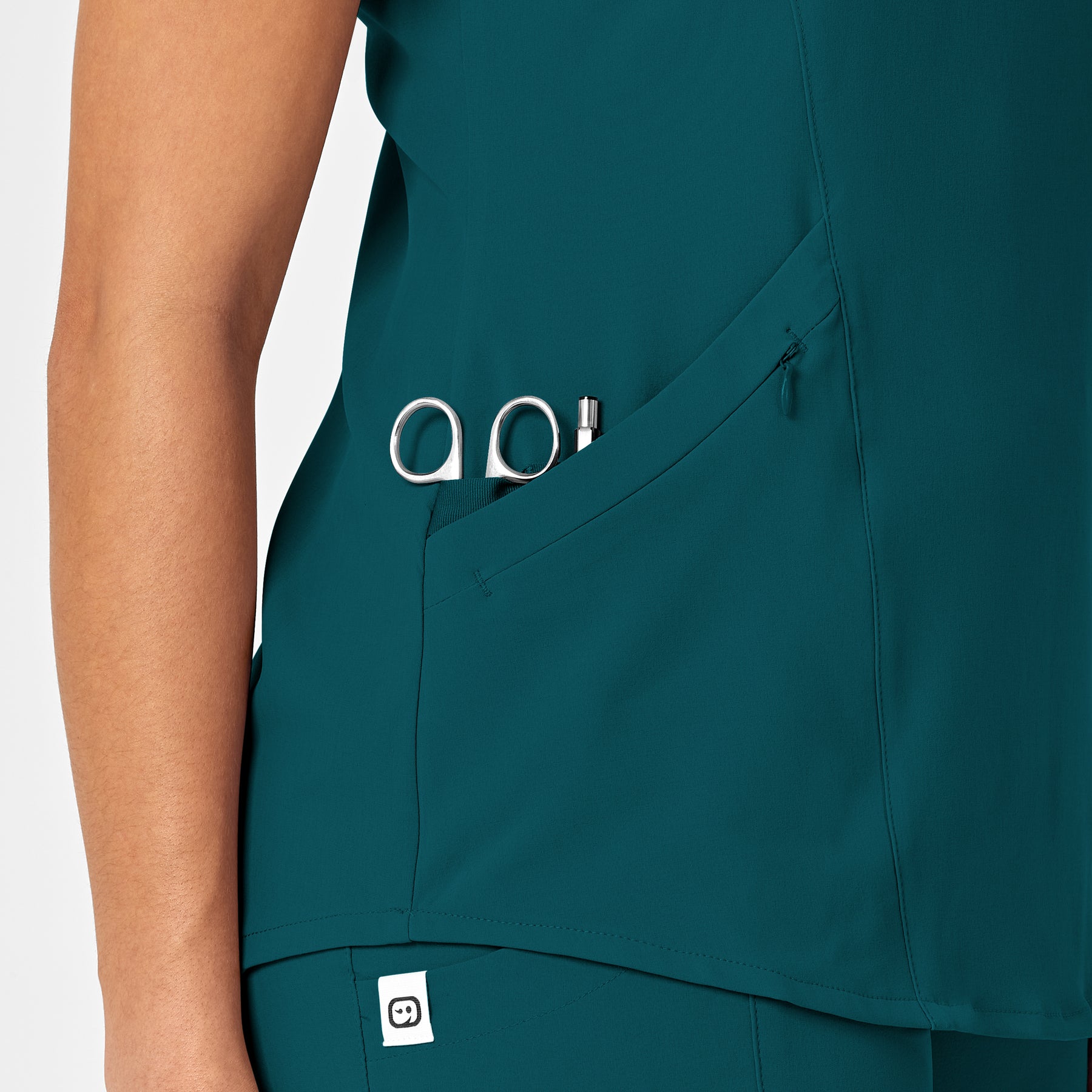 RENEW Women's V-Neck Scrub Top Caribbean Blue hemline detail