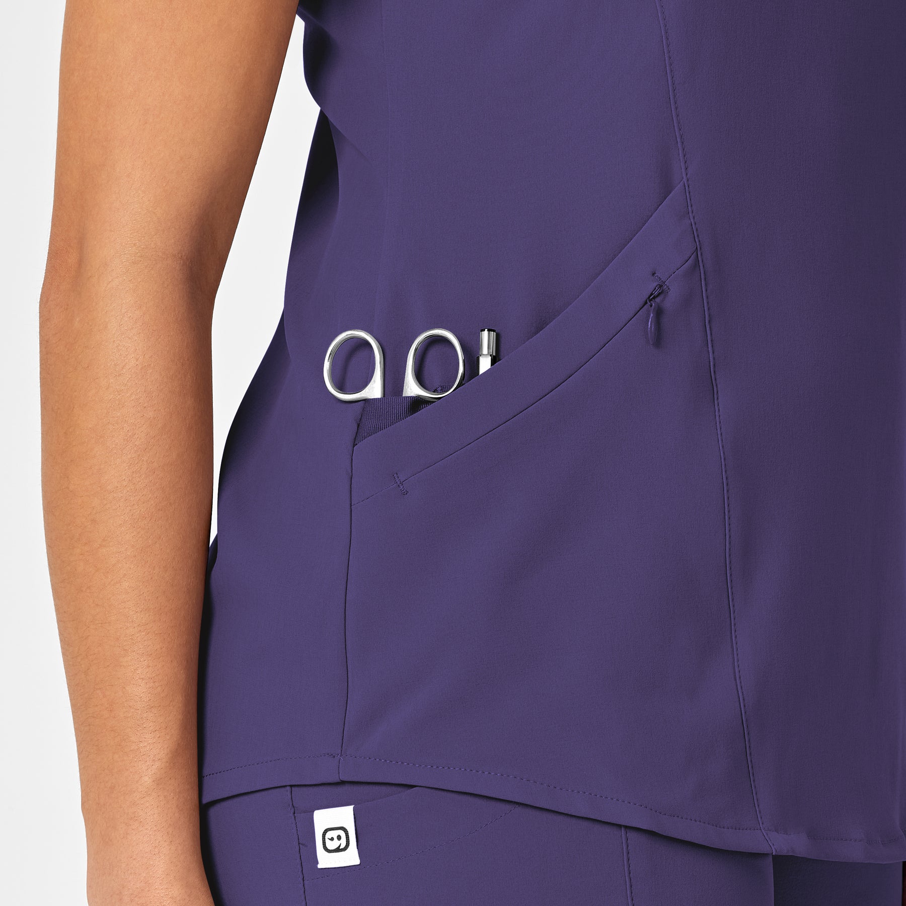 RENEW Women's V-Neck Scrub Top Grape hemline detail