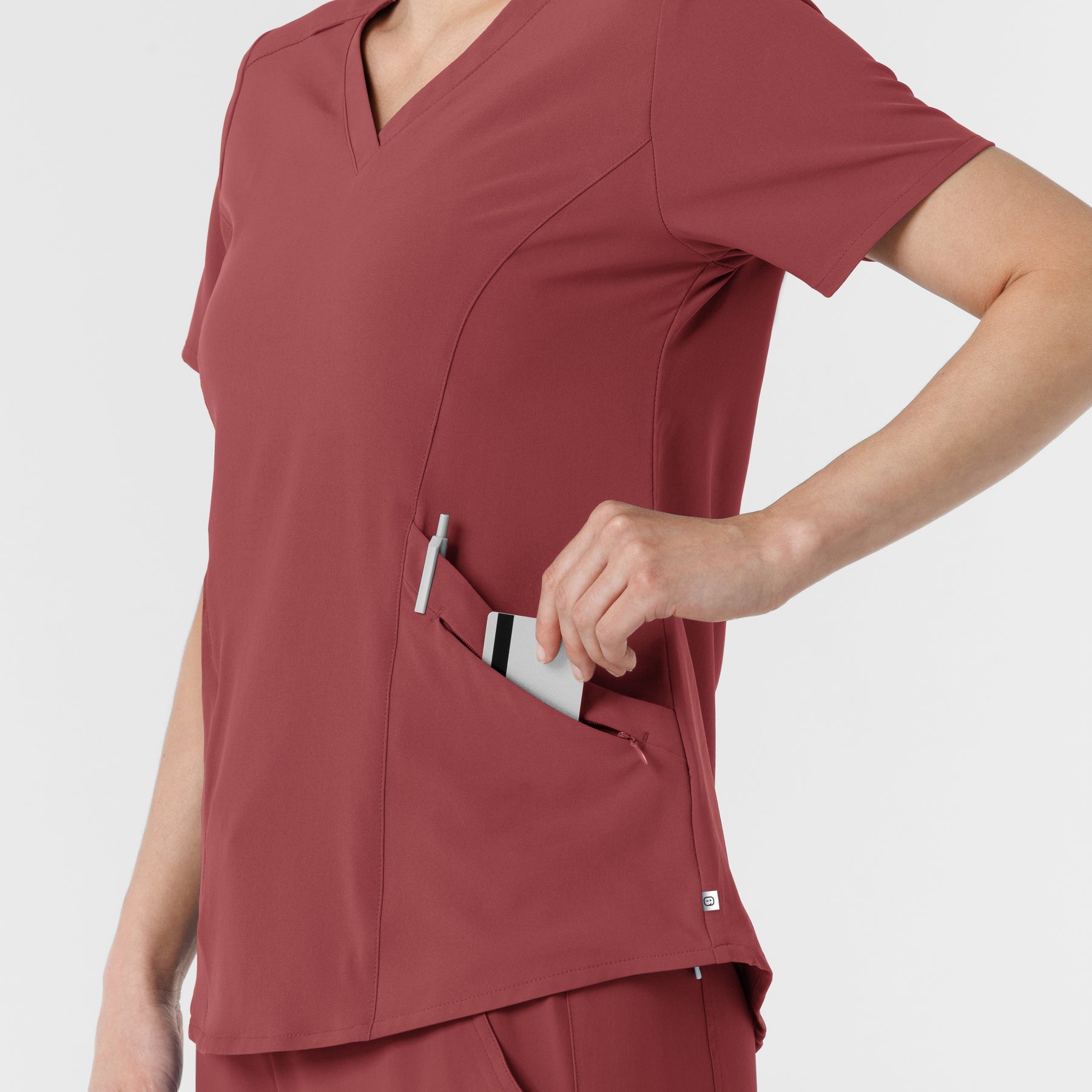 RENEW Women's V-Neck Scrub Top Ruby hemline detail