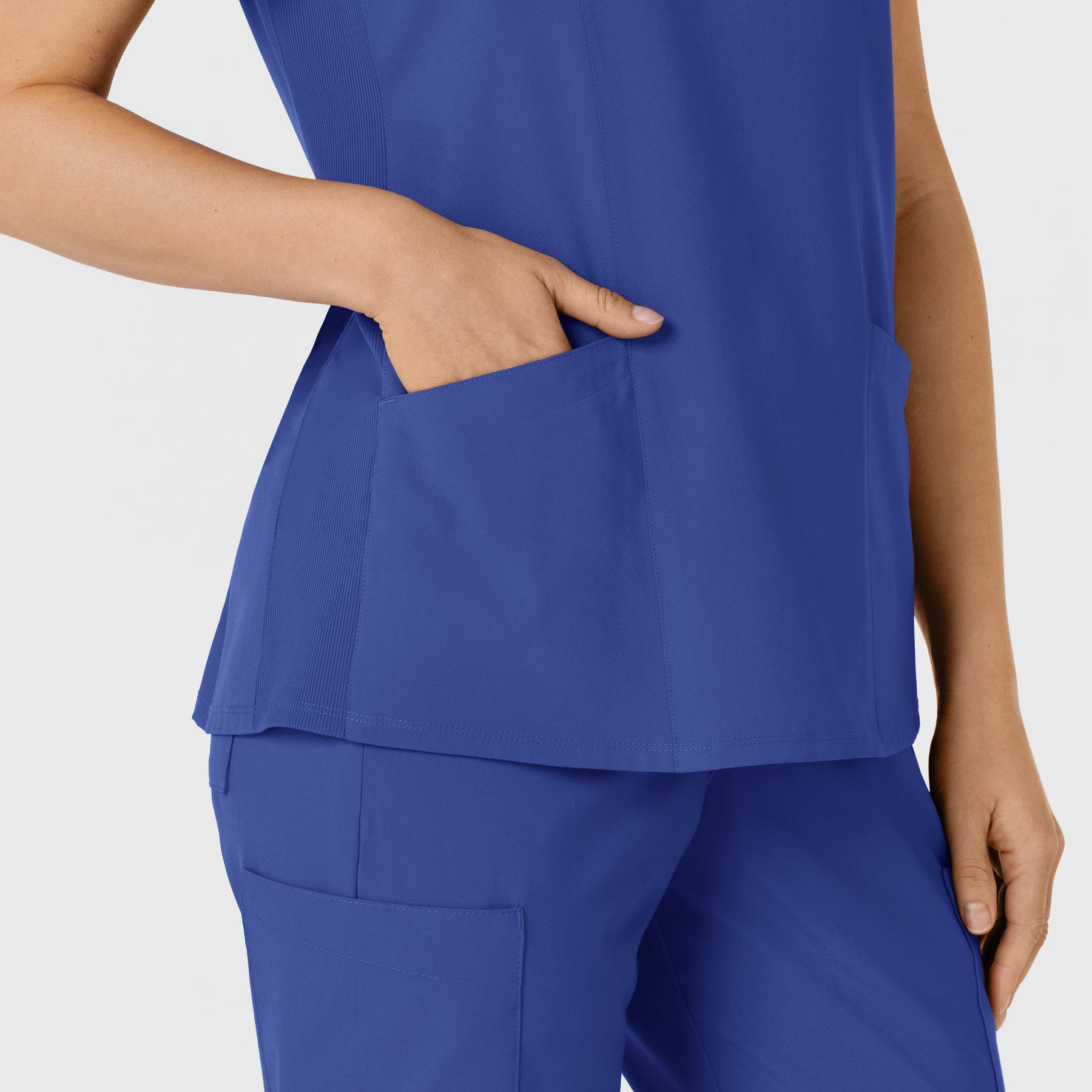 W123 Women's Flex-n-Reach Side Panel V-Neck Scrub Top Galaxy Blue hemline detail