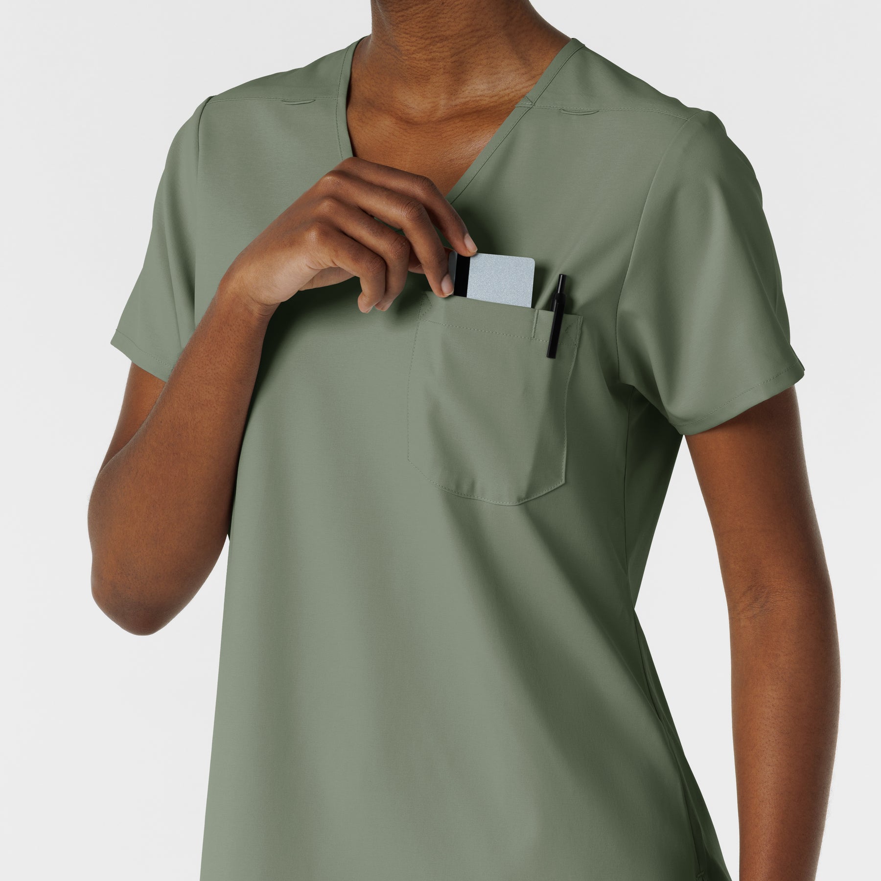 Boundless Women's Tuck-In Scrub Top Sage hemline detail