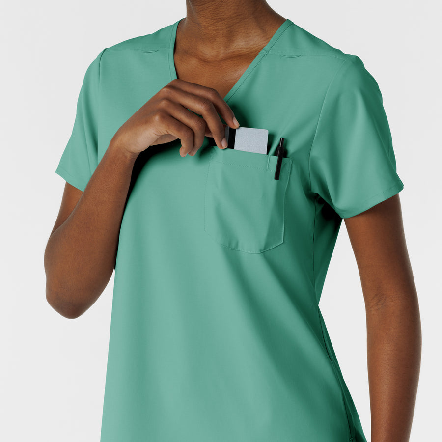 Boundless Women's Tuck-In Scrub Top Turquoise hemline detail