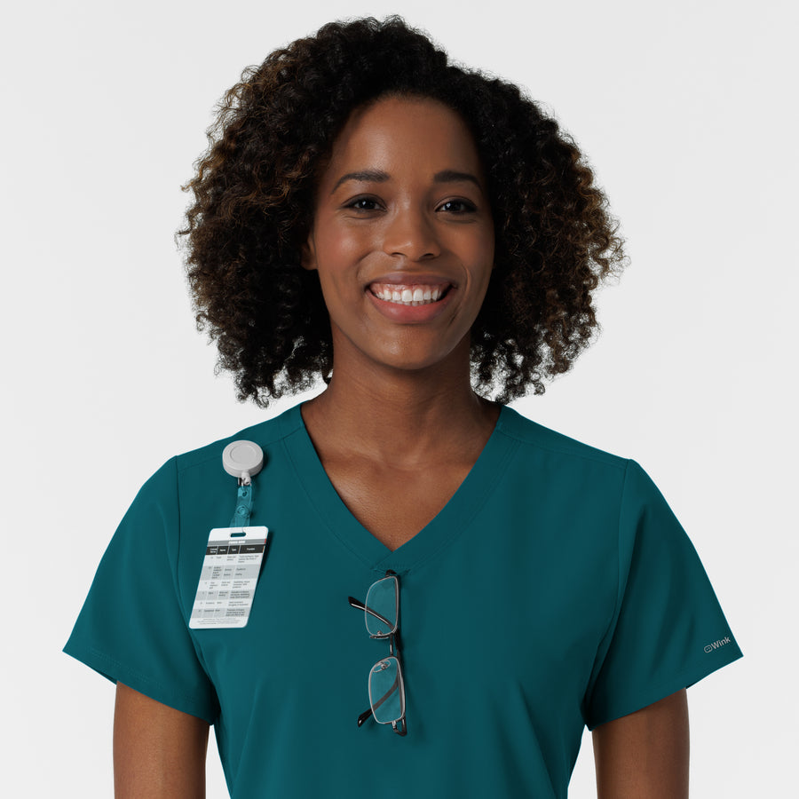 NURTUR Women's V-Neck Scrub Top - Caribbean badge and glasses loop