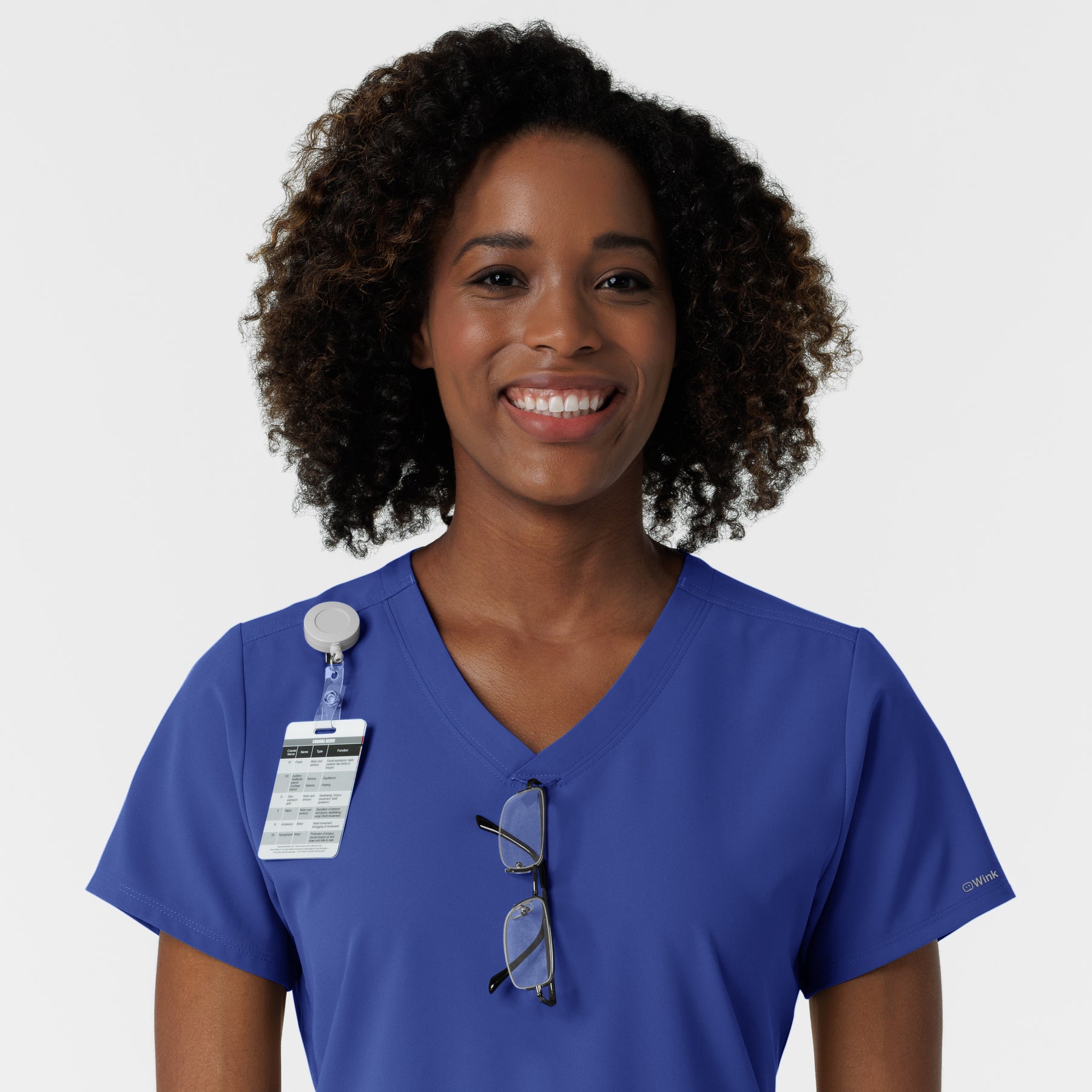 NURTUR Women's V-Neck Scrub Top - Galaxy Blue badge and glasses loop