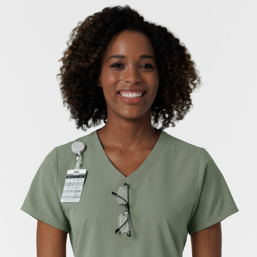 NURTUR Women's V-Neck Scrub Top - Sage badge and glasses loop