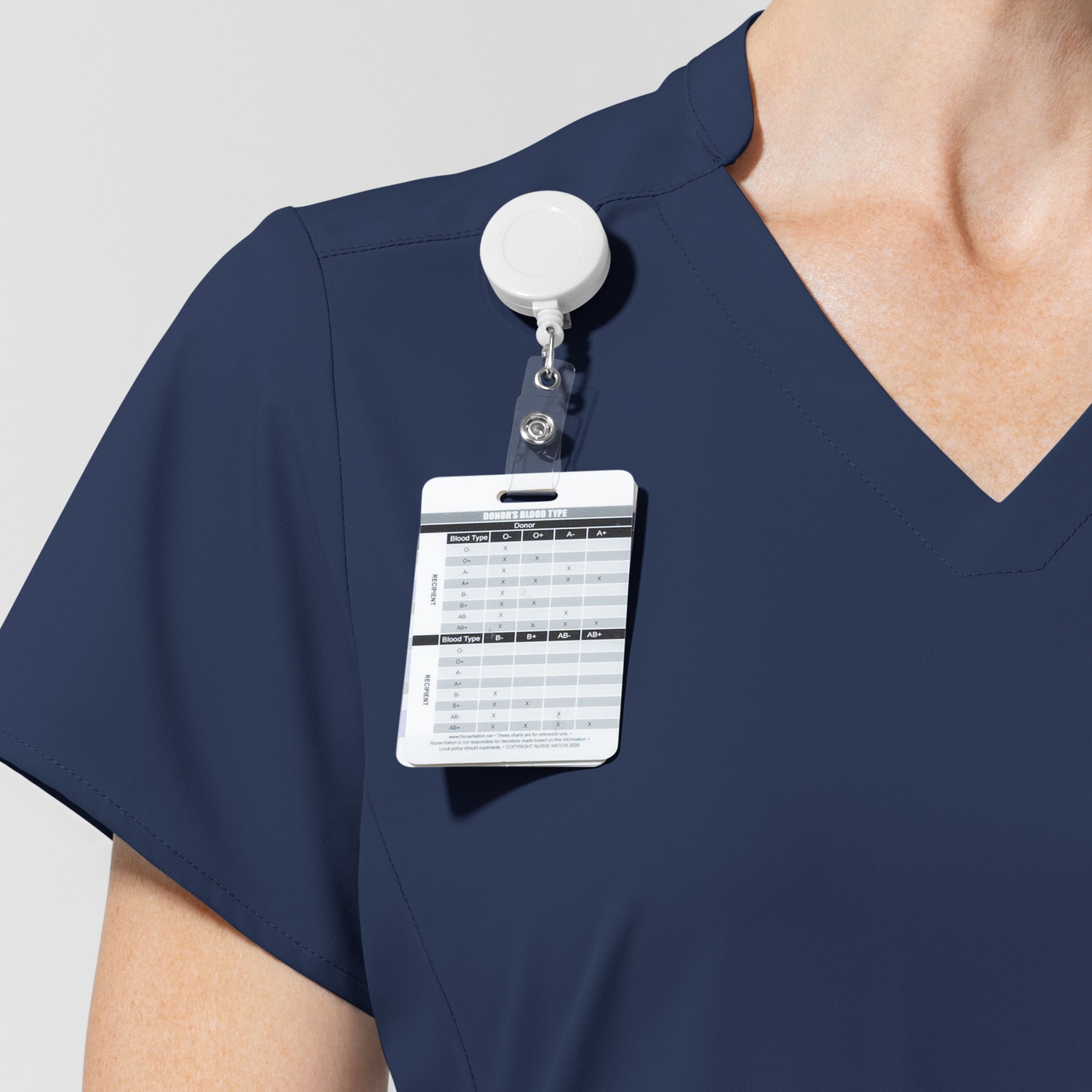 AURA Women's Allure V-Neck 2 Pocket Scrub Top Navy hemline detail