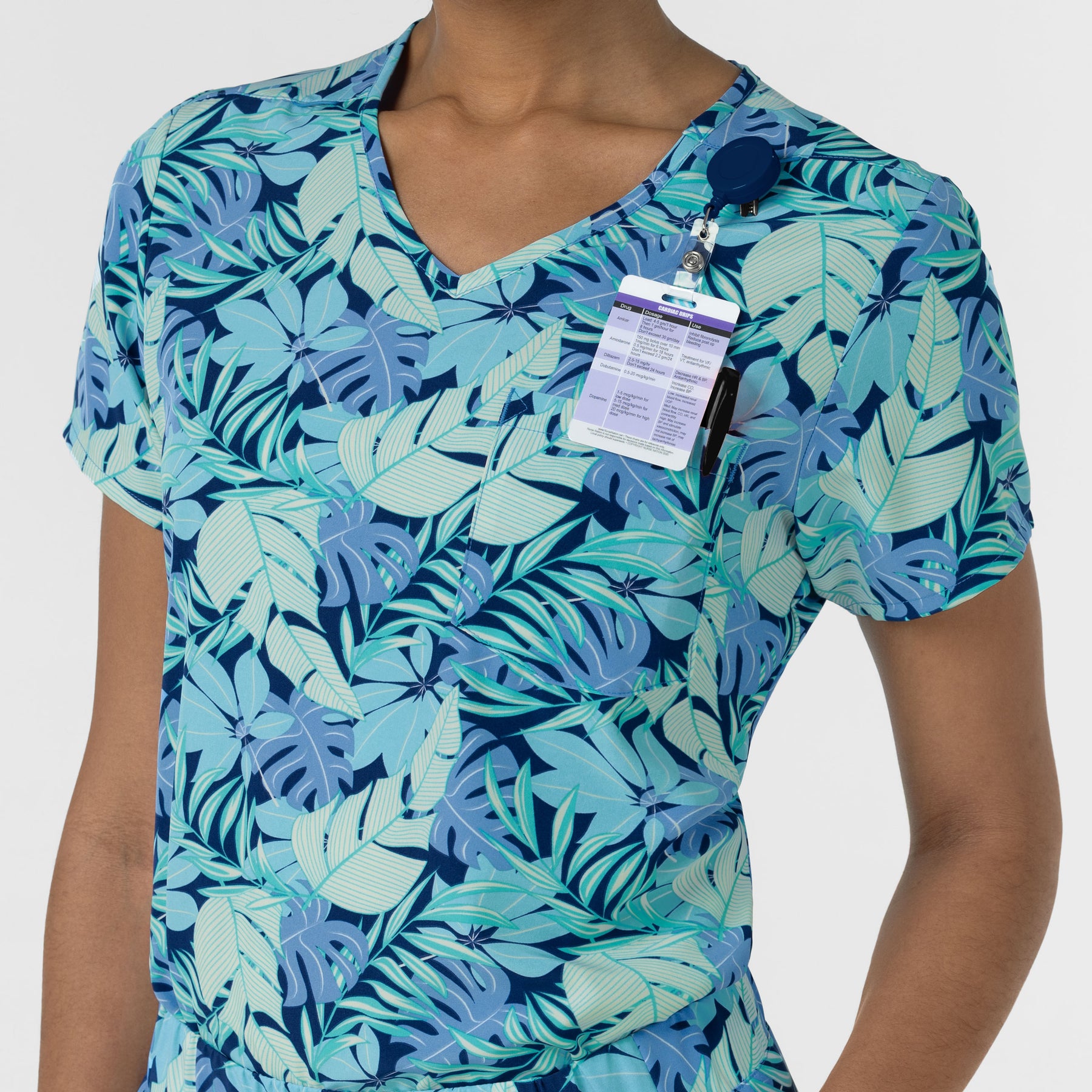 Women's 1-Pocket Tuck-in Print Scrub Top - Breezy Palms badge loop