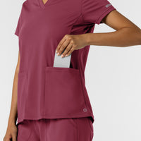 RENEW Knit Women's 2-Pocket Scrub Top Carnation hemline detail