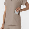 RENEW Women’s Flex-n-Reach Collared Scrub Top Haze hemline detail