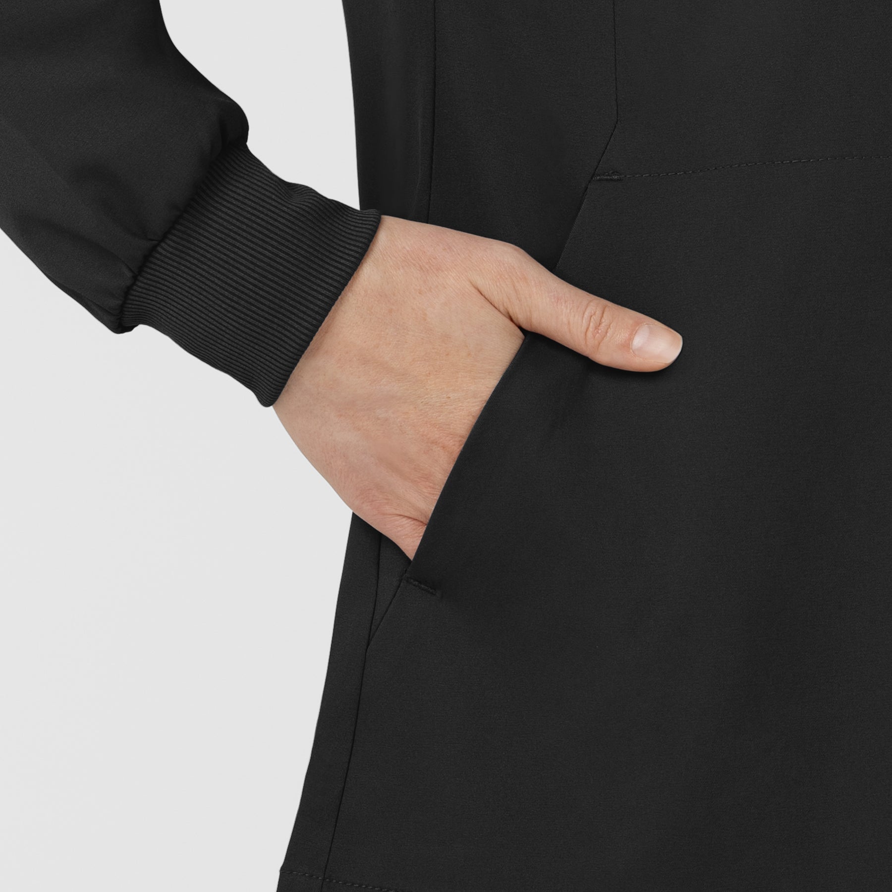 Boundless Women’s Warm-Up Scrub Jacket Black hemline detail