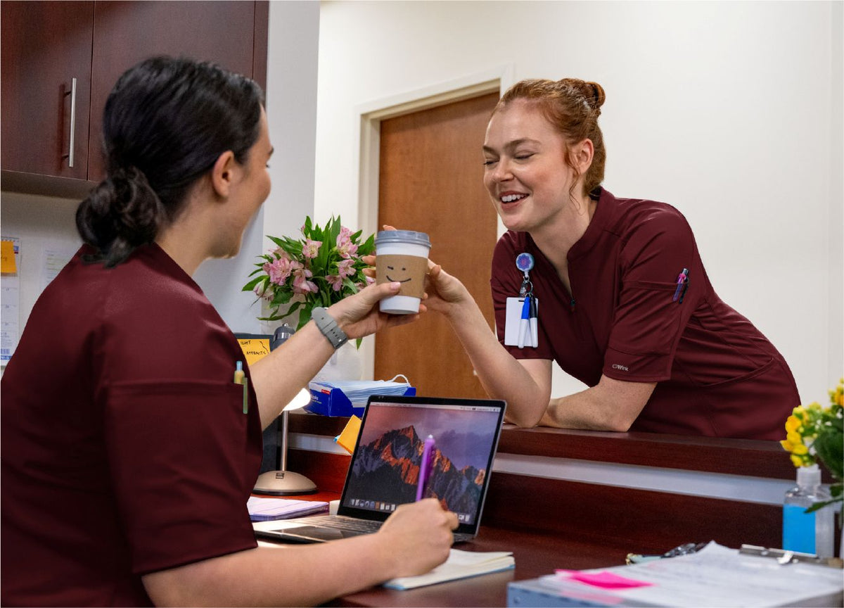 women in renew knits burgundy scrubs