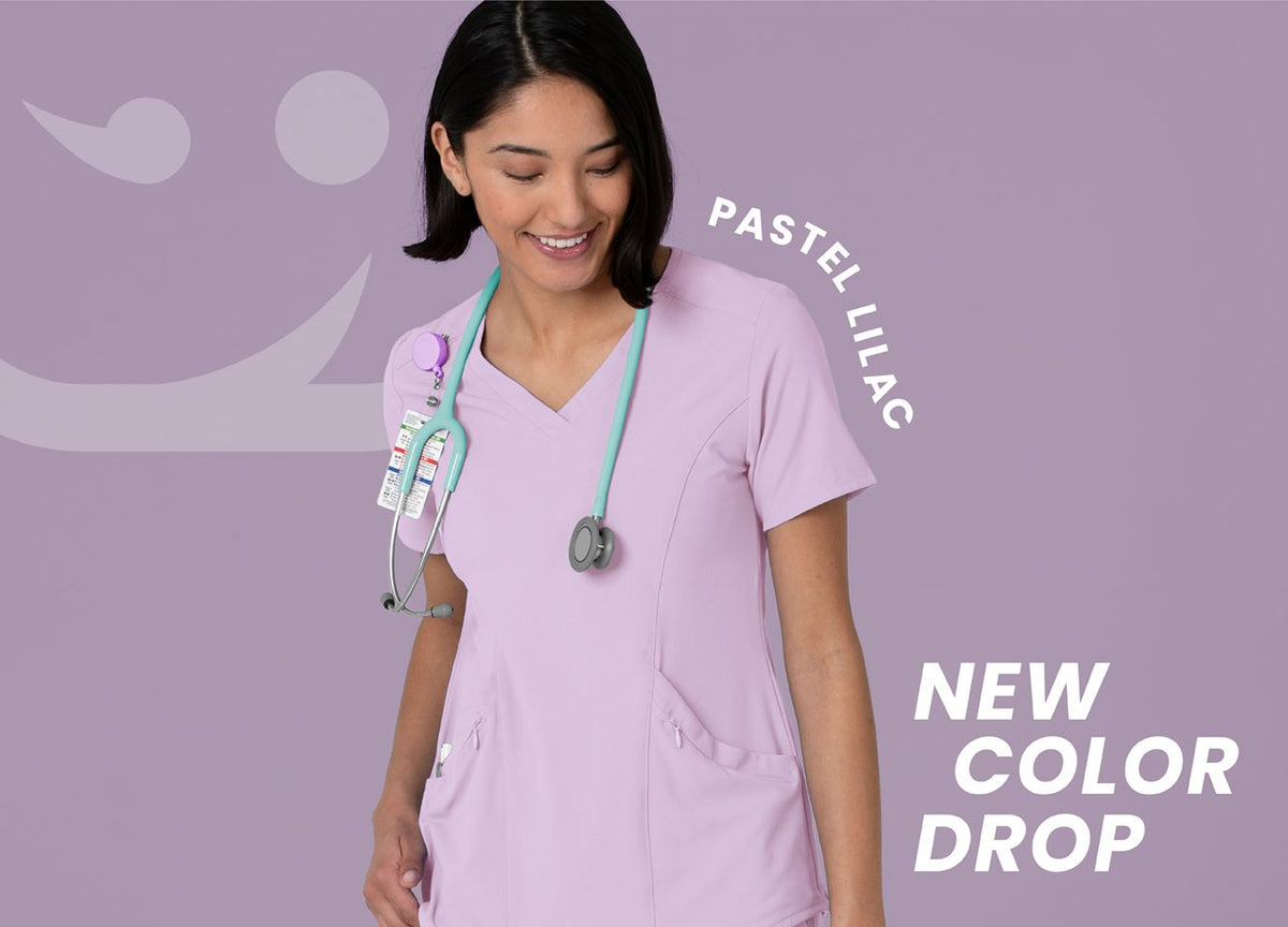 "Pastel Lilac; New Color Drop" Woman in purple scrubs with a stethescope over her shoulder