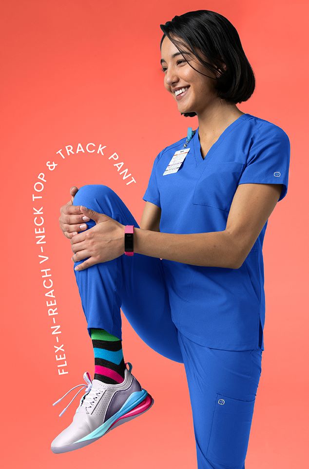 Flex-n-reach v-neck top & Track Pant in Royal. Comfortable scrubs with knit panels that move with you.
