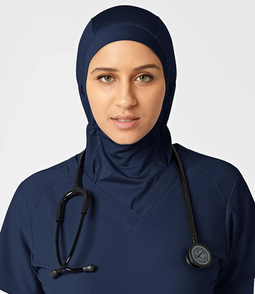 Woman wearing scrubs hijab and navy scrub top with a stethoscope.